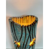 Beautiful raku cracks and a glossy glaze give it its elegance. A unique piece
