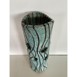 Beautiful raku cracks and a glossy glaze give it its elegance. A unique piece