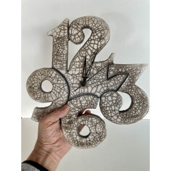 Magnifique pendule murale en céramique raku blanc brillant